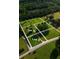 Overhead shot of lots 2 and 3 amidst lush greenery and homes with a road running through the property at 2726 Talley Ln, Buford, GA 30519