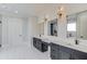 Bright bathroom features marble floors, custom cabinetry, and modern lighting fixtures at 2726 Talley Ln, Buford, GA 30519
