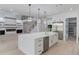 Large kitchen with a center island with stainless steel dishwasher and an attached sink, and modern appliances at 2726 Talley Ln, Buford, GA 30519