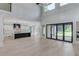 Open-concept living room showcasing soaring ceilings, modern finishes, and a seamless flow to the kitchen and outdoor patio at 2726 Talley Ln, Buford, GA 30519