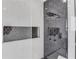 Modern shower with marble tile, rain shower head, and built-in shower niche at 2726 Talley Ln, Buford, GA 30519