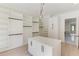Large walk-in closet with custom shelving, center island, and bright, natural light at 2726 Talley Ln, Buford, GA 30519