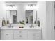 Modern bathroom featuring double sink vanity, white countertops, and bright lighting at 1048 Standard Ne Dr, Brookhaven, GA 30319