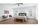 Bright bedroom suite featuring a ceiling fan, two windows, and carpet floors at 1048 Standard Ne Dr, Brookhaven, GA 30319