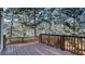 Expansive wooden deck surrounded by mature trees, perfect for outdoor entertaining and relaxation at 1048 Standard Ne Dr, Brookhaven, GA 30319