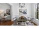 Formal dining room with stylish lighting, wainscoting, and hardwood floors at 1048 Standard Ne Dr, Brookhaven, GA 30319