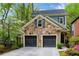 Charming two-story home featuring stone accents, a two-car garage, and professionally landscaped yard at 1048 Standard Ne Dr, Brookhaven, GA 30319