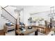 Open concept living room with hardwood floors, modern furniture, and a view into the kitchen and dining area at 1048 Standard Ne Dr, Brookhaven, GA 30319