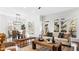 Open-concept living space with large windows, hardwood floors, and a dining area at 1048 Standard Ne Dr, Brookhaven, GA 30319