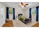 Bright bedroom with hardwood floors, large window, and closet with doors at 2396 Midvale Cir, Tucker, GA 30084