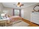 Bright bedroom with hardwood floors, ceiling fan, and ample natural light at 2396 Midvale Cir, Tucker, GA 30084