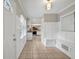 Inviting entryway features tile flooring and built-in bench seating at 2396 Midvale Cir, Tucker, GA 30084