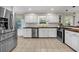 Spacious kitchen boasts stainless steel appliances, white cabinets, and wood countertops at 2396 Midvale Cir, Tucker, GA 30084