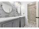Elegant bathroom with double vanities and a tiled walk-in shower at 4440 Spring Mtn Ln, Powder Springs, GA 30127