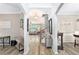 Inviting entryway with views of the living room and a staircase at 4440 Spring Mtn Ln, Powder Springs, GA 30127