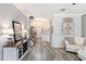 Spacious hallway with wood-look floors, staircase and decor at 4440 Spring Mtn Ln, Powder Springs, GA 30127
