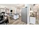 Well-lit kitchen with a center island open to the living area at 4440 Spring Mtn Ln, Powder Springs, GA 30127