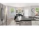 Eat-in kitchen features stainless steel appliances, granite countertops and a view to the backyard at 4440 Spring Mtn Ln, Powder Springs, GA 30127