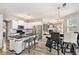 Modern kitchen with white cabinets, black countertops, and stainless steel appliances at 4440 Spring Mtn Ln, Powder Springs, GA 30127