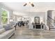 Open-concept living room leads into the dining area and kitchen at 4440 Spring Mtn Ln, Powder Springs, GA 30127