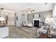 Comfortable living room with a fireplace and stylish décor, great for entertaining at 4440 Spring Mtn Ln, Powder Springs, GA 30127