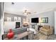 Cozy living room with fireplace, neutral decor, and lots of natural light at 4440 Spring Mtn Ln, Powder Springs, GA 30127