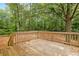 Wooden back deck overlooks the expansive backyard filled with mature trees and plenty of privacy at 21 Misty Hollow Ct, Euharlee, GA 30145