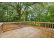 Spacious wooden back deck is perfect for entertaining and relaxing outdoors in a private backyard at 21 Misty Hollow Ct, Euharlee, GA 30145