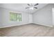 Bright bedroom with vaulted ceilings, large window, and contemporary flooring for a modern look at 21 Misty Hollow Ct, Euharlee, GA 30145