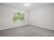 Neutral bedroom featuring one window and new carpeting at 21 Misty Hollow Ct, Euharlee, GA 30145