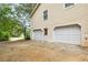 Spacious two-car garage with additional one-car garage offers ample parking and storage space at 21 Misty Hollow Ct, Euharlee, GA 30145