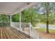View from the porch overlooking lush greenery, enhancing the outdoor living space at 21 Misty Hollow Ct, Euharlee, GA 30145