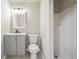 Bathroom featuring a tiled floor, gray vanity with drawers, standard toilet, and shower stall at 225 Bayswater Dr, Suwanee, GA 30024