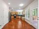 Modern kitchen with stainless steel appliances, wooden cabinets, and access to the outdoor deck at 225 Bayswater Dr, Suwanee, GA 30024