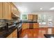 Modern kitchen with granite countertops and stainless steel appliances at 225 Bayswater Dr, Suwanee, GA 30024