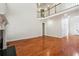 Spacious living room with hardwood floors, fireplace, and soaring ceilings creates an airy atmosphere at 225 Bayswater Dr, Suwanee, GA 30024