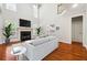 Bright living room boasts hardwood floors, fireplace, and natural light at 225 Bayswater Dr, Suwanee, GA 30024