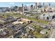 Aerial view of a city neighborhood with houses, and downtown city skyline at 230 Woodward Se Ave, Atlanta, GA 30312