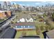 An aerial view of the neighborhood with homes, trees, and a city skyline at 230 Woodward Se Ave, Atlanta, GA 30312