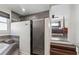 Bathroom with large tub and tiled shower, and doorway view into bedroom with four poster bed, ceiling fan, and flat screen TV at 230 Woodward Se Ave, Atlanta, GA 30312