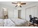 A bright bedroom featuring a ceiling fan, a computer desk, and easy access to the en-suite bathroom at 230 Woodward Se Ave, Atlanta, GA 30312