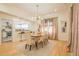 A bright dining room with modern chandelier, comfortable seating, and direct access to the kitchen at 230 Woodward Se Ave, Atlanta, GA 30312