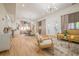 Bright and airy living room featuring stylish decor, wood floors, and natural light at 230 Woodward Se Ave, Atlanta, GA 30312