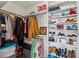 Spacious walk-in closet with built-in shelving and hanging rods for organized storage of clothes, shoes, and accessories at 230 Woodward Se Ave, Atlanta, GA 30312