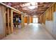 Unfinished basement showcasing concrete floor, exposed ceiling, framed walls, and walkout to the backyard at 3770 Falling Leaf Ln, Cumming, GA 30041