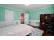 Cozy bedroom showcases light and dark furniture, hardwood floors, and ample closet space at 3770 Falling Leaf Ln, Cumming, GA 30041