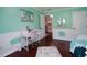 Bright bedroom with white desk, pink chair, and stylish decor, creating an inspiring space at 3770 Falling Leaf Ln, Cumming, GA 30041