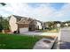 Two-story home with brick and siding exterior, manicured lawn, two-car garage, and attractive landscaping at 3770 Falling Leaf Ln, Cumming, GA 30041