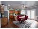 Eat-in kitchen boasts wood cabinets, granite countertops, stainless steel appliances, and a spacious island at 3770 Falling Leaf Ln, Cumming, GA 30041