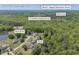 Expansive aerial view of the Powder Springs, GA community, featuring homes, schools, and lush greenery near Mill Creek and Bennett Rd at 582 Linda Ln, Powder Springs, GA 30127
